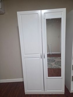 Wardrobe with added mirror