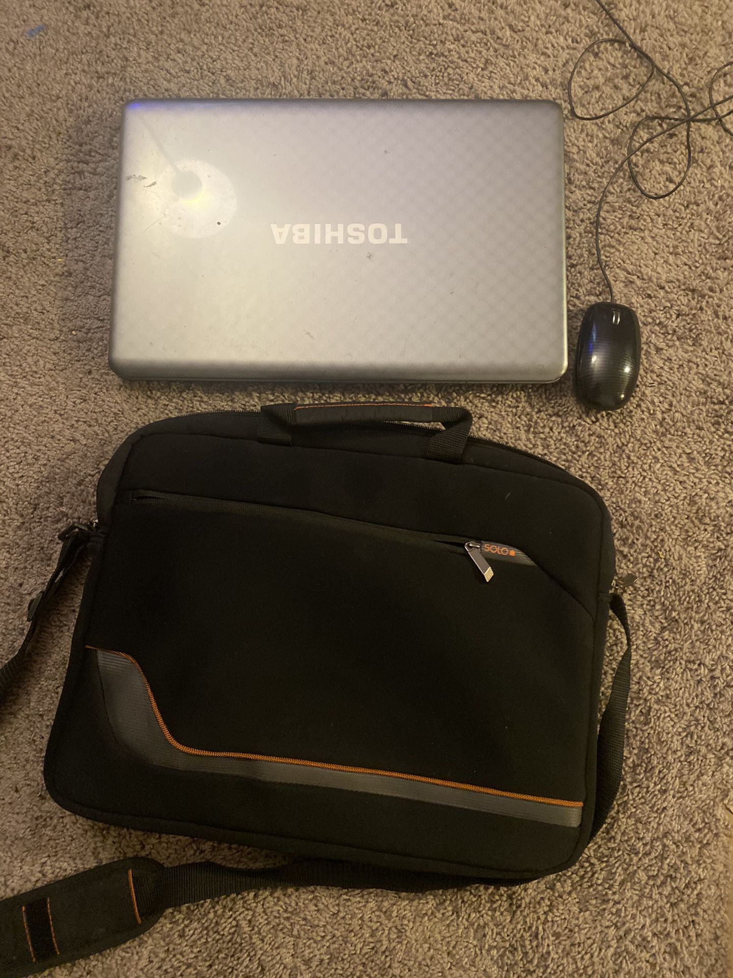 Toshiba Laptop with chargers, mouse, and case