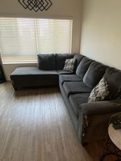 Gray sectional with pull out bed