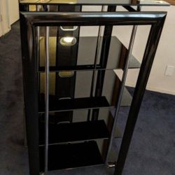 Entertainment center, black with 5 glass shelves. Very nice and heavy.