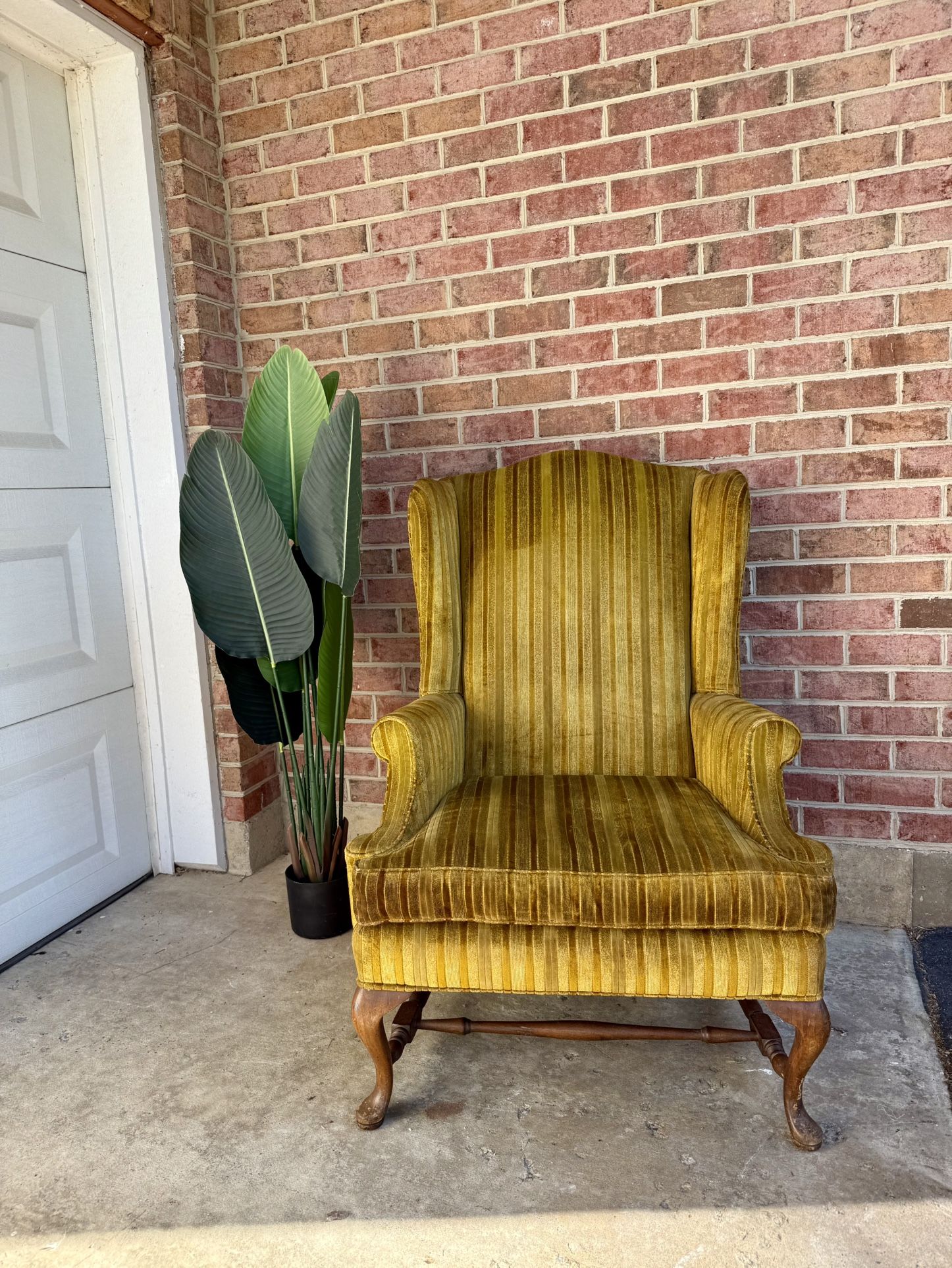 Green and Gold Velvet Wingback Chair with Carved Wood Legs