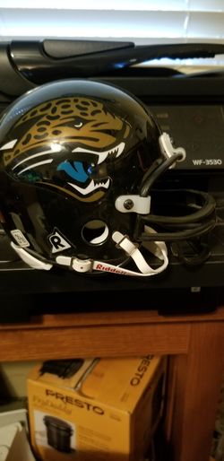 JACKSONVILLE JAGUARS MINI HELMET AND INCLUDES SMALL MINI PALM SIZE HELMET