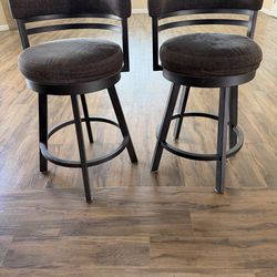 Swivel Stool with low Curved back/Fabric Counter Stool 360-degree swivel mechanism and a durable metal frame  27” Counter Height 17” Seat Width 17” To