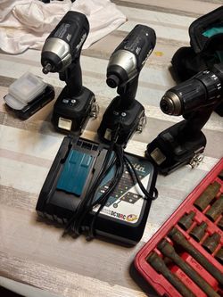 3 tool set drill driver impact driver and impact wrench with 80 piece socket set charging port and 4 lithium batteries.