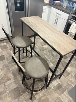 Faux gray wood 2 person table with 2 barstools