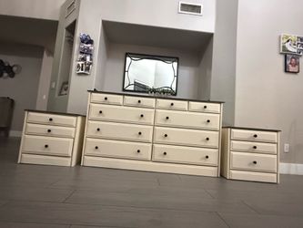 Three piece wood- bedroom set: dresser,  2 nightstands