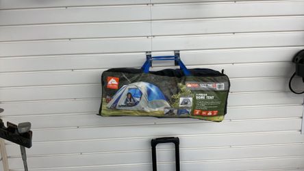 Ozark Trail 4-Person Dome Tent designed for camping with a 8-foot by 8.5-foot footprint.