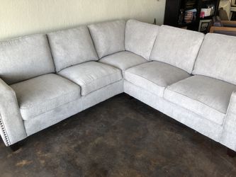 New sectional gray in color Nail head trim