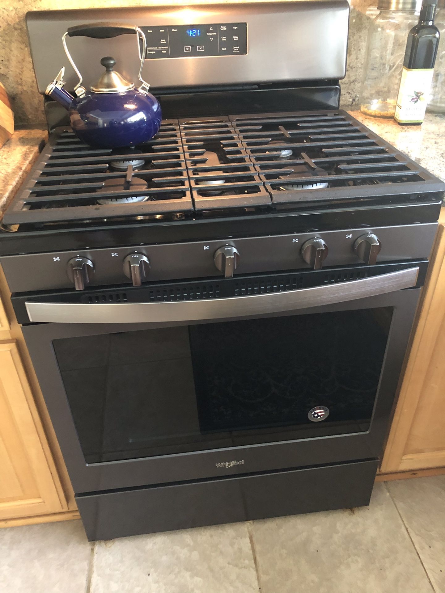 Whirlpool 5.0 cu. ft. Freestanding Gas Range with Center Oval Burner-Black Stainless Steel