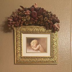 Sweet Picture Of Sleeping Cherub. Framed In Detailed Gold Frame Vintage Looking Comes With table Mantle And Elegant Glittering Wreath Added 