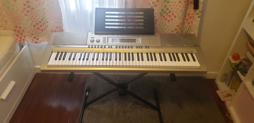 Casio WK-200 Keyboard with Stand and Attachable Music Stand