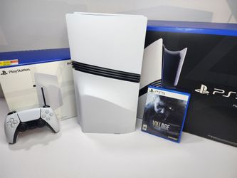 Sony PlayStation 5 Pro with added detachable disk drive and Resident Evil Village game.