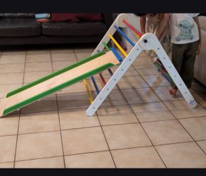 Wooden climbing triangle with slide