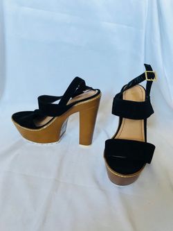 Pair of black open-toe ankle strap heels