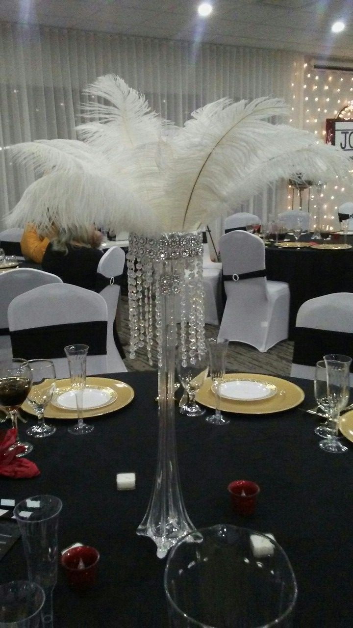 Wedding centerpieces, feather centerpieces (ostrich feathers, Eiffel tower vases) Hollywood/great Gatsby theme