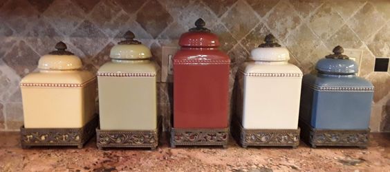 Like New Set of 5 Graduating Quality Ceramic Canisters in Removable Iron Bases