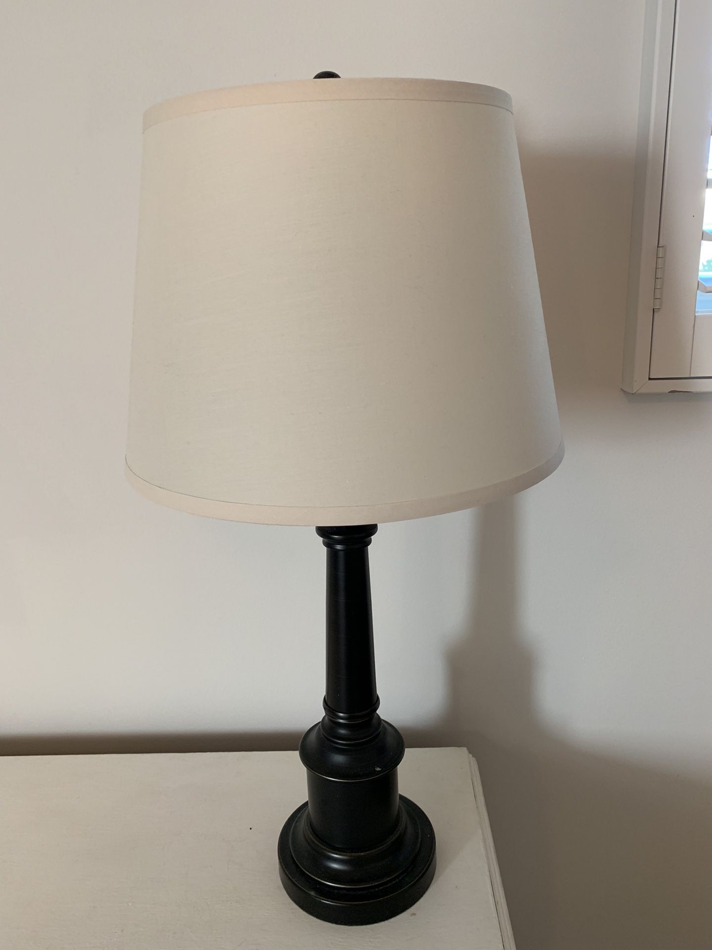 Two matching lamps with cream shades