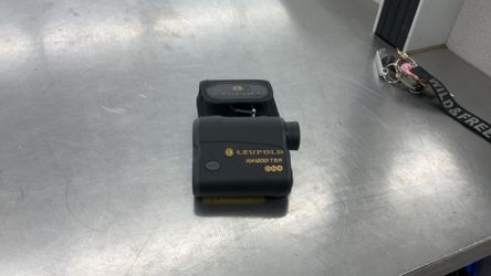 Leupold RX-1200i TBR/W Digital Laser Rangefinder alongside its black carrying case