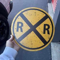 Metal railroad sign