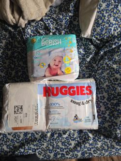Size 1 Huggies  diapers and Honey Bebsih size 2 diapers.