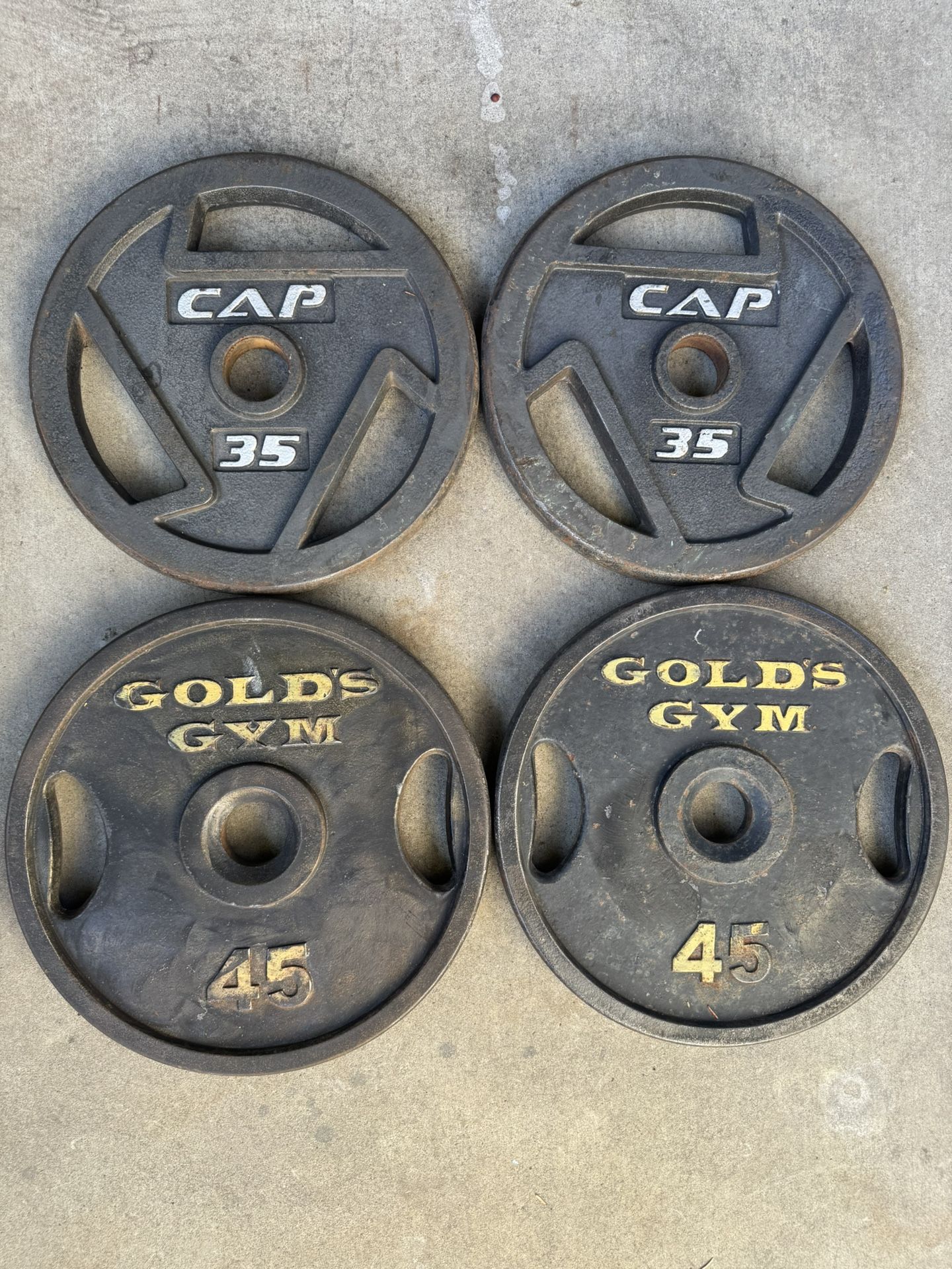 Pair Of 35 And 45 Pound Olympic Weights 