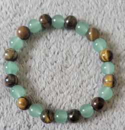 Stretch beaded bracelet crafted from two specific gemstones: Green Aventurine and Tiger's Eye. New.