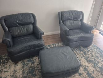 2 Blue leather chairs and ottoman