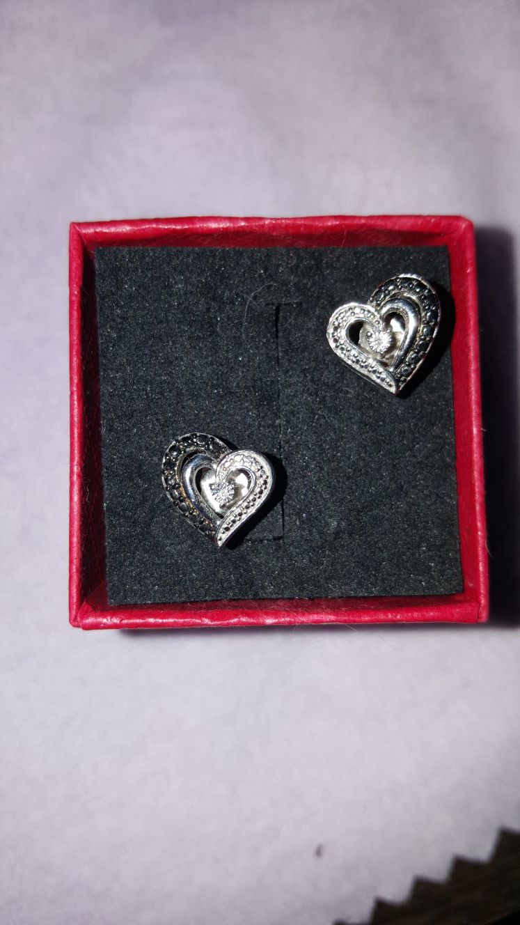 Black and white diamond heart earrings.