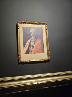 Gold Frame With Creepy Preast Picture