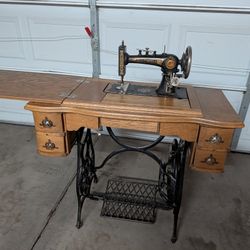 Antique Sewing Machine With Solid oak and Iron Poinsettia Treadle