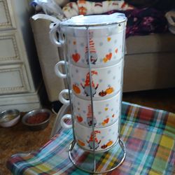 Four soup or coffee cups with stand