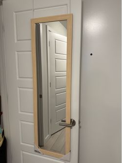 Hanging mirror with hooks