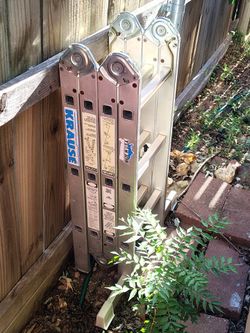 Folding extension ladder .