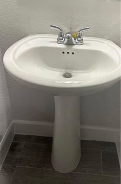 White Pedestal Sink with Chrome Faucet