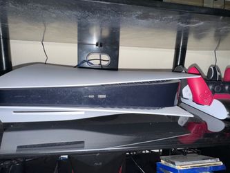PlayStation 5 Disc Edition with 500GB, two controllers and charging stations, and one PS5 game (Resident Evil village)
