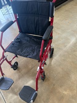 Red Transport Wheelchair with Footrests