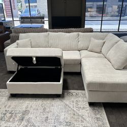 Cream Sectional And Storage Ottoman