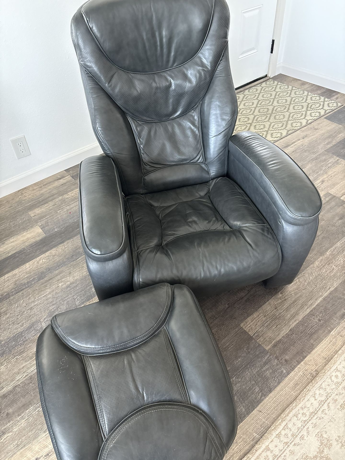 Two black leather chairs with ottoman with Storage