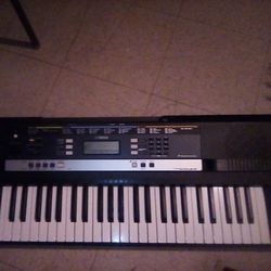 Yamaha Electric Keyboard With Stand And And Front Table To Read Music.