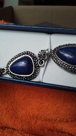 Lapis bracelet with floral accents.