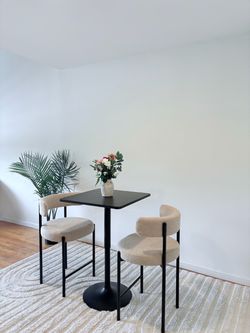 Black Bistro Table with Two Boucle Chairs