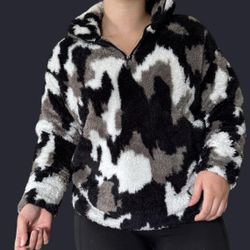 Eddie Bauer Women's Quest Plush 2.0 1/4-zip pullover in a black, white, and gray