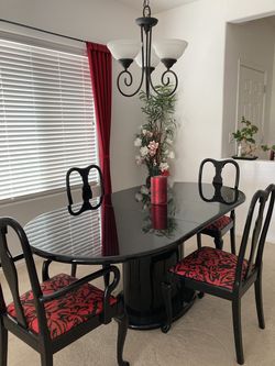 Black lacquer dining set, table and four chairs.