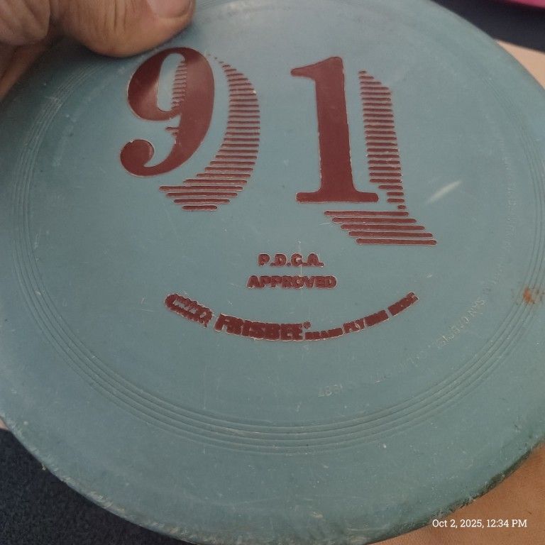 FRISBEE 91" disc golf midrange disc in teal.