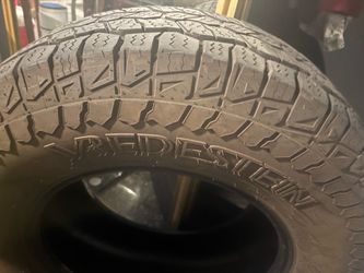 265/70/17 4 tires Bridgestone All-Terrain Tire on Wheel