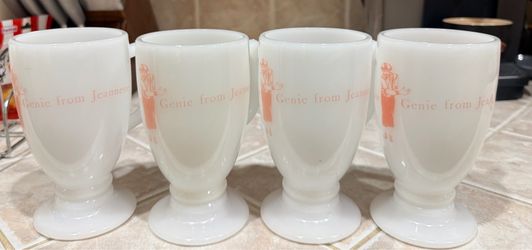 vintage milk glass pedestal mugs featuring a "Genie from Jeannette" graphic