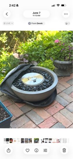 Round Outdoor Fire Put with Black Stones