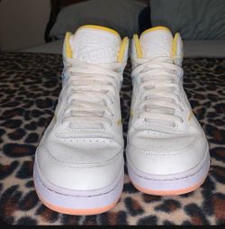 White and multi-color Reebok shoes