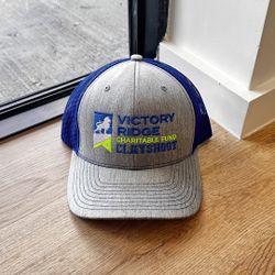 Victory Ridge Charitable Fund Cap – Grey/Blue Adjustable Hat
