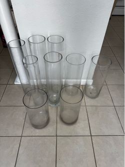 9 Glass Cilynder . 3 H 27 1/2” D6”. 2 H20”D 7 1/2”. 2 H 16”D 8” . 2 H16” D 8” . 2 H25” D 5”